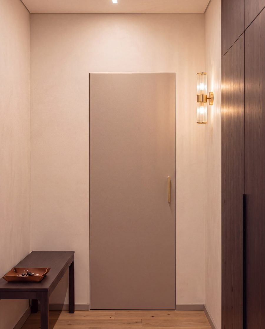Full-height door with a slim brass handle